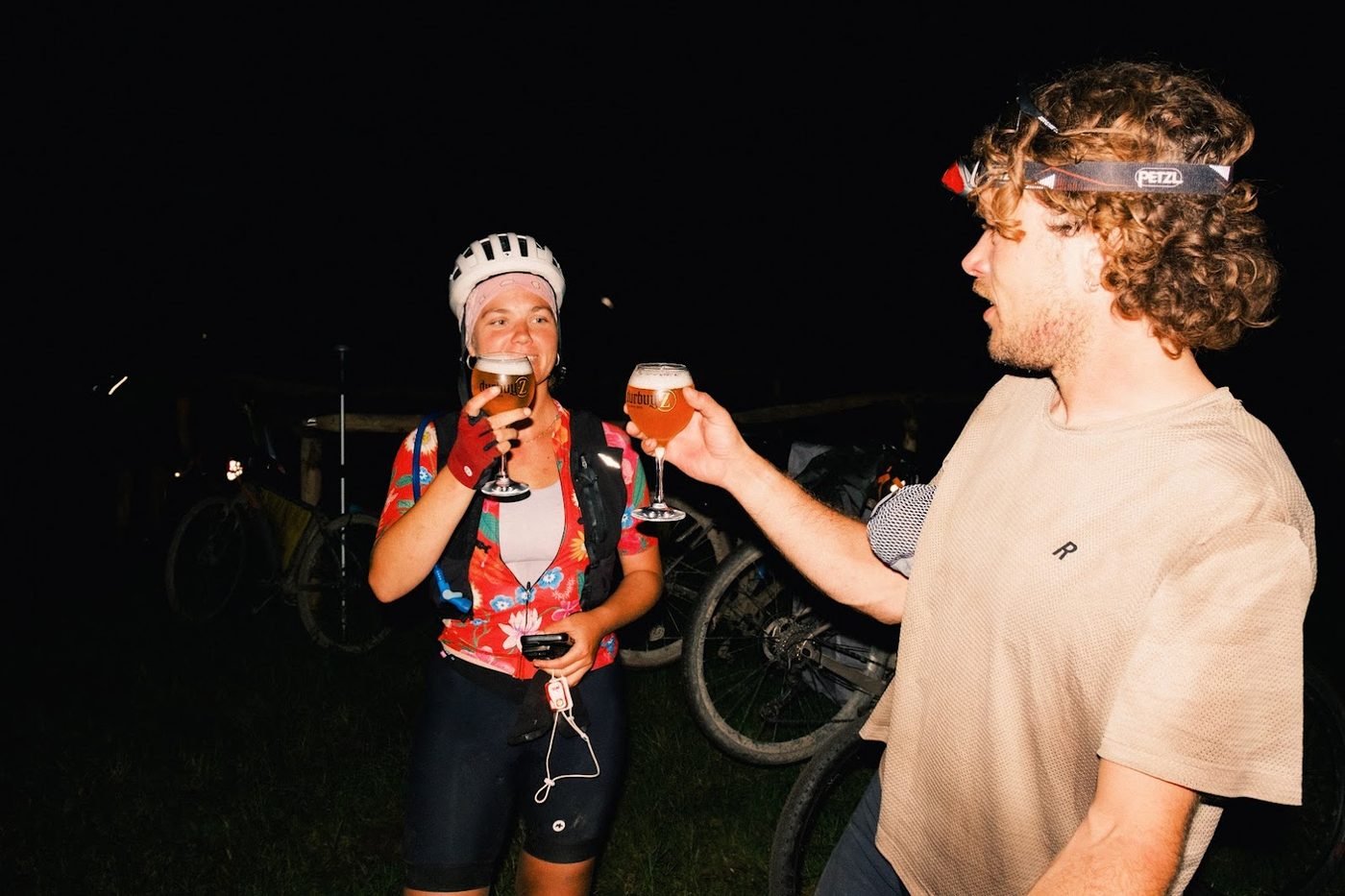 Riders toasting with Durbuy-Z beer after dark